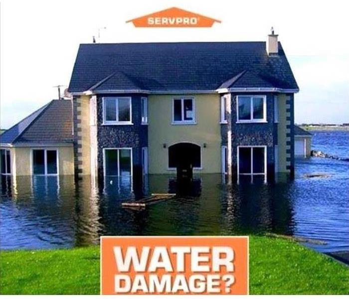 House being flooded with SERVPRO logo